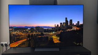 LG C5 with landscape shot of city at night on screen 