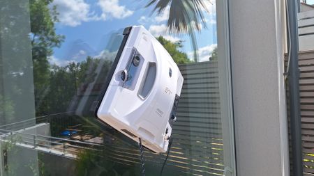 Hobot S7 Pro window cleaning robot on outside of reviewer's patio door window
